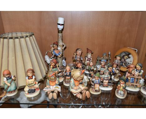 A COLLECTION OF TWENTY TWO GOEBEL HUMMEL FIGURES, A HUMMEL LAMP WITH SHADE AND A HUMMEL REUGE MUSICAL PICTURE,  the Hummel fi