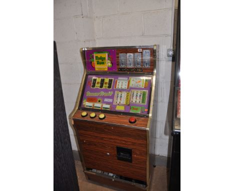 A VINTAGE BELL FRUITS SLOT MACHINE with 'Bonus Fruits' graphics and mechanism, height 144cm (untested and may be internally i