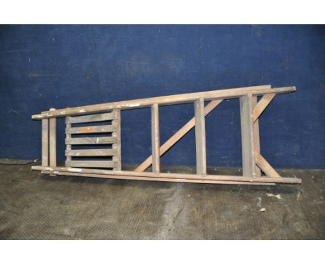 A PAIR OF VINTAGE WOODEN STEP LADDERS with three rungs and top platform height 133cm