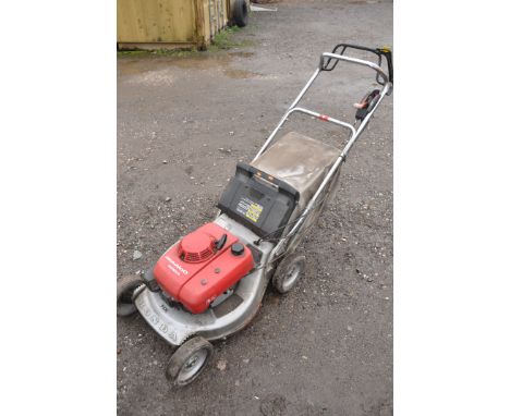 A HONDA HRA2100 HX PETROL SELF PROPELLER LAWNMOWER, with grass box (condition report: pulls, starts first time and not tested