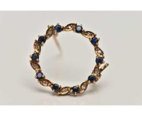 A 9CT GOLD SAPPHIRE AND DIAMOND BROOCH, circular brooch set with alternating circular cut blue sapphires and single cut diamo