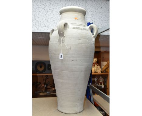 A LARGE TUNISIAN CLAY AMPHORA/URN, rustic handmade with four handles, height 74cm (1) (Condition Report: no visible chips or 