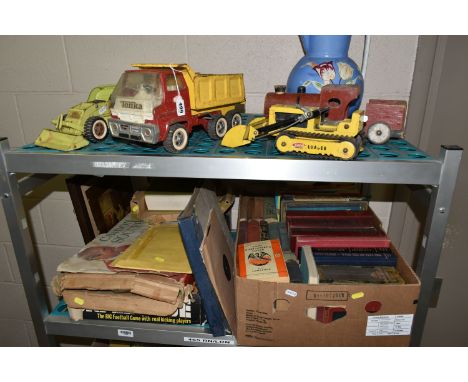 A BOX AND LOOSE 1970'S TONKA TOYS, BOOKS AND GAMES, to include Tonka Tipper Truck, tracked and wheeled Loaders and a Car Carr