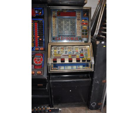 A JPM SLOT MACHINE with 'Cash bonus' graphics and mechanism (untested and maybe internally incomplete) (no keys)