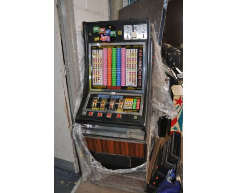 AN AINSWORTH SLOT MACHINE with 'Aristocrat Classic Magic Touch' graphics and mechanism (untested and maybe incomplete interna