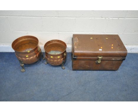 A BROWN METAL TRAVELING TRUNK, width 65cm x depth 43cm x height 40cm, and two sized copper log buckets, with twin brass handl