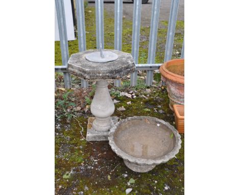 A COMPOSITE OCTAGONAL SUNDIAL, with a loose lead top, diameter 40cm x height 55cm, along with a low composite bird bath (cond