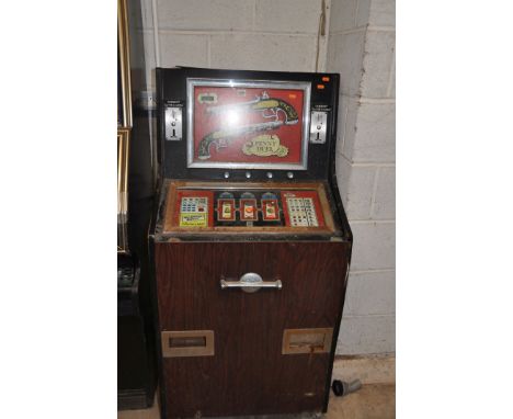 A VINTAGE 'LEEDS' SLOT MACHINE with 'Penny Duel' graphics, width 67cm x height 140cm (untested and may be incomplete internal