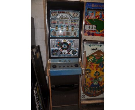 AN ACE COIN EQUIPMENT VINTAGE SLOT MACHINE with 'Silver Machine' graphics and mechanism, width 53cm depth 55cm height 188cm (