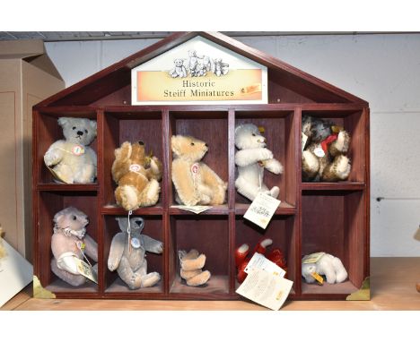 A STEIFF `HISTORIC STEIFF MINIATURES` DISPLAY CASE CONTAINING TEN MINIATURE STEIFF BEARS, comprising 029073 Cinnamon Bear, 02