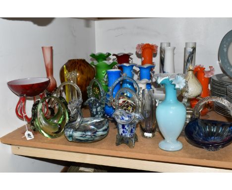 A GROUP OF COLOURED GLASSWARE, comprising an opaque blue and white glass jug with a clear frilled handle and rim, multi colou