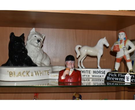 FOUR PIECES OF CERAMIC BREWERIANA, comprising a large Crown Devon 'Black &amp; White' Scotch Whisky  bottle display stand, he