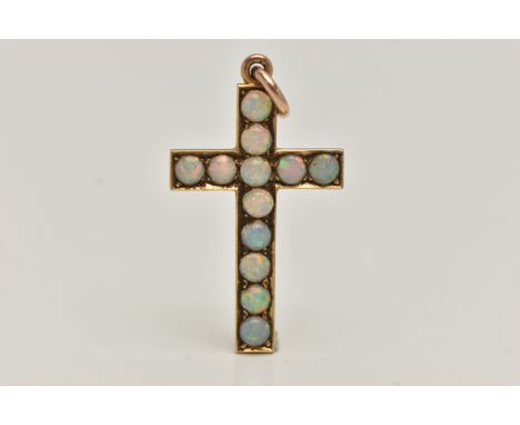 A YELLOW METAL OPAL CROSS PENDANT, set with twelve circular cut opal cabochons, to a polished mount, fitted with a jump ring,