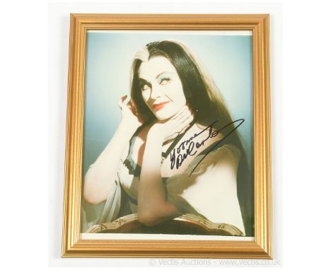 The Munsters Yvonne De Carlo signed photo, 10"x8", framed. Good Plus. NO COA. NB. If item needs to be posted, the photo will 