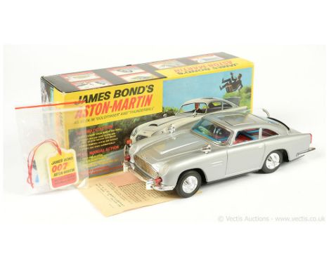 Gilbert vintage 6701 James Bond tinplate/plastic battery operated Aston Martin DB5 finished in silver-grey, chrome trim, with