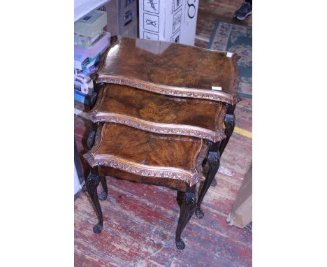 A Nest of three vintage tables with glass tops. Shipping unavailable 