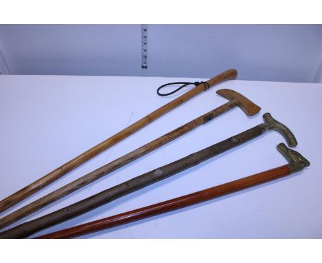 A selection of vintage walking sticks including brass headed examples, shipping unavailable 