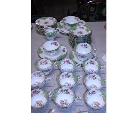 A large Paragon bone china tea service 'Rockingham Green' 