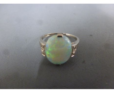 A platinum and white gold 18ct diamond and opal ring size K - opal approx 11mm x 10mm - approx weight 2.9 grams - good condit