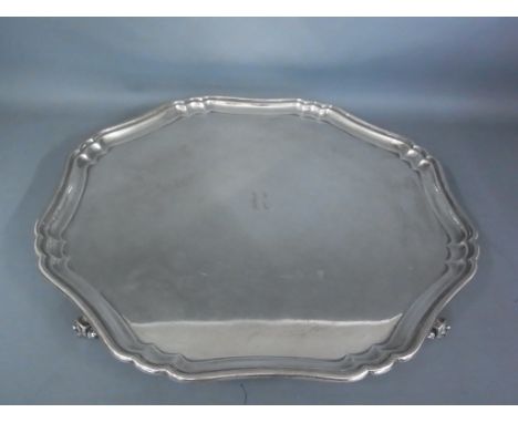 A hallmarked silver Sterling tray raised on four scroll feet with pie-crust boarder monogrammed engraved R to centre - Weight