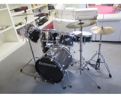 A Ludwig Drum kit, six drums, a stool and three cymbals Condition report: Used but condition good 