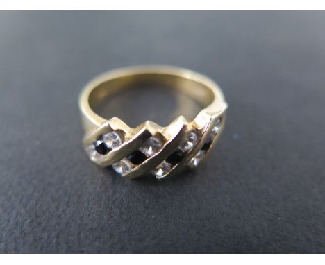 An 18ct yellow gold ring - size R - Weight approx. 5.9gmsCondition report: Some usage marks, stones bright 