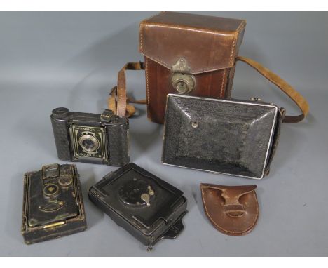 A collection of four vintage cameras to include a Kamera Werkstatten folding camera with a rollex-patent film back fitted in 