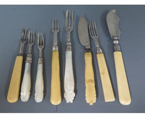 Four silver hallmarked pickle forks, two fish knives and forks, three items with mother of pearl handles Condition report: No