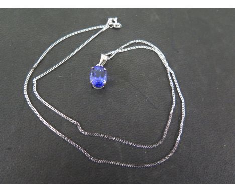 An 18ct AAA tanzanite gold pendant the 2.869ct oval cut tanzanite in white gold surround on white gold chain approx 4.6 grams