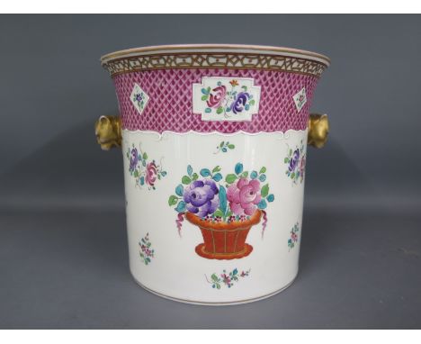 A ceramic ice pail - possibly Samson with gilt highlighted lions head handles hand painted in foliate design - Diameter 18cm 