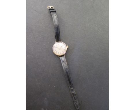 A 9ct yellow gold manual wind ladies wristwatch - 24mm wide - working order - wear and denting to case