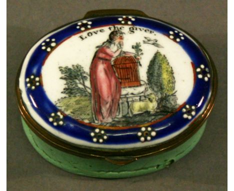 A LATE 18TH CENTURY BILSTON ENAMEL PATCH BOX of hinged circular form, decorated with a young girl freeing a caged bird, with 