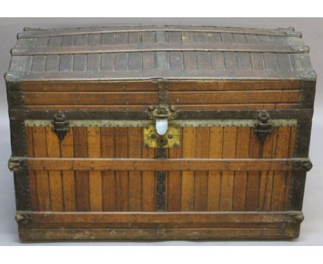 A VICTORIAN RIBBED AND DOMED TRUNK, ribbed construction with iron bound edges and corners. 68cm(h) x 98cm(w) x 54cm(d)  CONDI