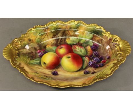 A ROYAL WORCESTER PORCELAIN HAND-DECORATED DISH of oval form, the moulded gilt rim and shell-form handles enclosing painted d