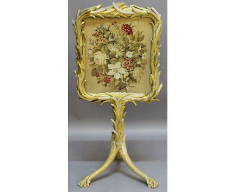A 19TH CENTURY GILT-WOOD FIRESCREEN the floral needlework panel within a foliate giltwood surround, on a conforming pedestal 