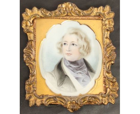 After Daniel Maclise  A 19TH CENTURY PORTRAIT MINIATURE, watercolours on ivory panel, depicting Charles Dickens, in a shaped 