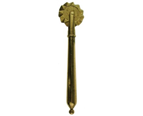 A 19TH CENTURY COPPER-ALLOY PASTRY JIGGER with tapering stem and wheel, the terminal with later ring for suspension, 17.8cm l