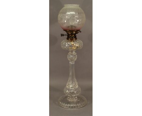 A 19TH CENTURY CUT-GLASS PEDESTAL OIL LAMP with associated etched and cranberry tinted globular shade over the Hinks & Sons p