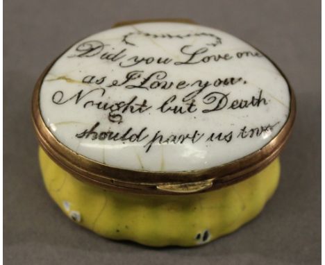 A 19TH CENTURY BILSTON ENAMEL PATCH BOX of hinged oval form, the domed cover with inscription and mirror to the interior, flu