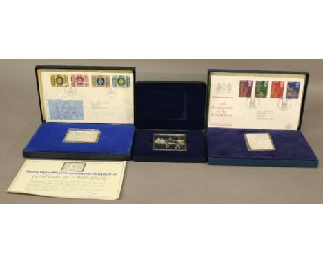 TWO DANBURY MINT SILVER COMMEMORATIVE STAMP EDITIONS, the first a Silver Jubilee edition with four official Silver Jubilee st