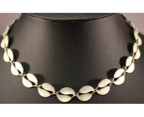 A DAVID ANDERSON (NORWAY) 925 STERLING AND ENAMEL NECKLACE comprising of multiple double leaf links in white enamel, the tong