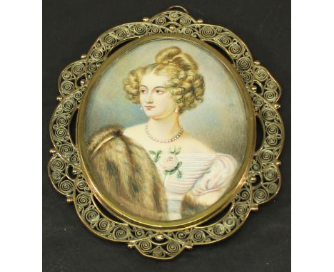A 19TH CENTURY PORTRAIT MINIATURE of oval form, watercolours on ivory panel depicting a young lady with pearl necklace, rose 
