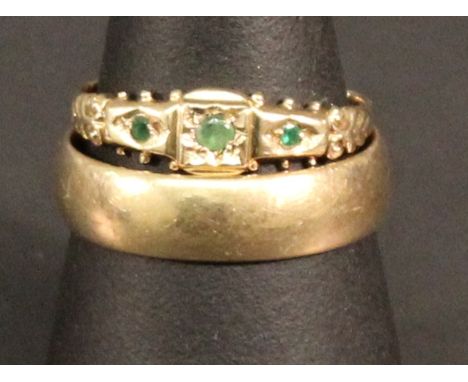 A 9CT GOLD WEDDING BAND of traditional form, marked 375, ring size S. 4grams, together with a 9ct gold emerald-set ring, mark