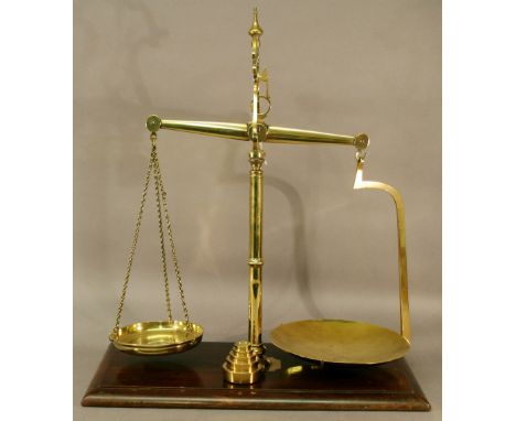 A BRASS AND MAHOGANY PATENT BALANCE SCALE by Bartlett, Bristol (1835-1920) of typical form, the central support mounted to a 