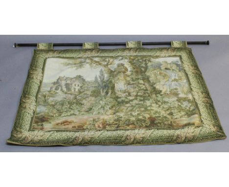 A MACHINE EMBROIDERED TAPESTRY WALL HANGING depicting a garden scene with watermill, turned pole suspension. 96cm x 117cm  CO