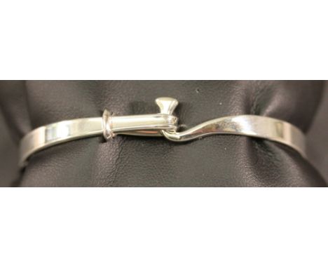A GEORG JENSEN 925S BANGLE of circular form, number 204 by Vivianna Torun, marked 925s, with Georg Jensen box. 6cm, 16grams  