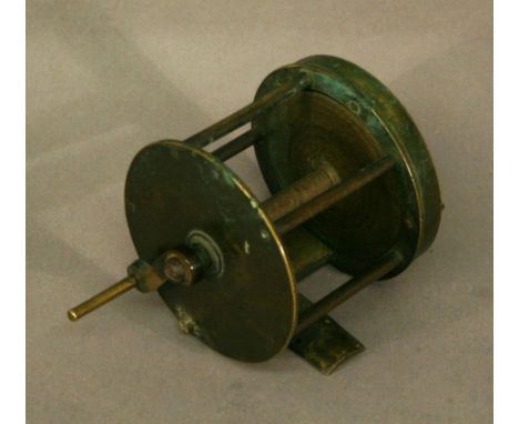 A BRASS 2 3/4" FISHING REEL of typical form. CONDITION: Used condition with some bending and splits to foot plate, oxidation 