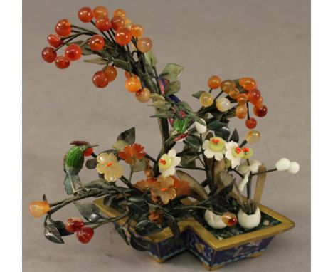 CHINESE CLOISONNE PLANTER of double lozenge form containing an arrangement of hard stone blossoms, berries and enamel birds. 