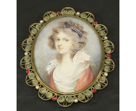 A 19TH CENTURY SCHOOL PORTRAIT MINIATURE of oval form, watercolours on ivory panel depicting a young lady with pearls in her 