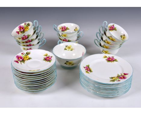 A partial set of eleven Shelley Begonia pattern trios, each trio comprising a tea cup, saucer and plate, floral decorated wit